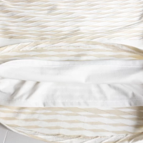 A photo of the lining of a Peplum Sleeveless Top in White Cream Color by White House Black Market.