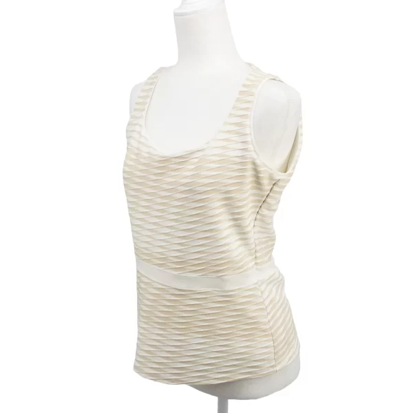 A photo of a sleeveless peplum top business casual