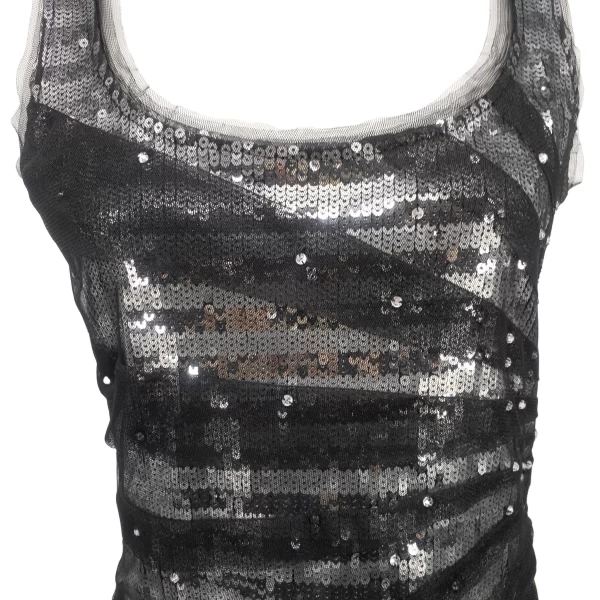 A photo of a close up view of a black sequin tank top by White House Black Market