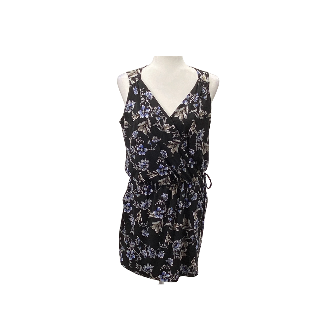 A photo of a White House Black Market Black romper with a floral print.