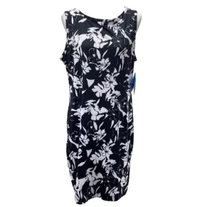 Front view of a Columbia Chill River Dress in size large, new with tags. The sleeveless black dress features a white floral print and is displayed on a mannequin.